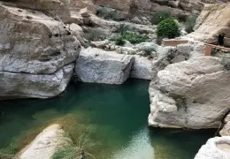 Wadi Ash Shab with turquoise pools and rocky canyon in Oman
